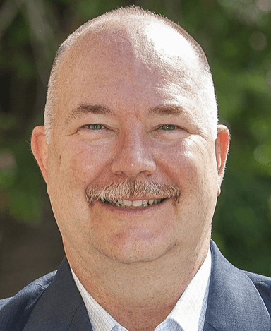 Professional headshot of Russell Merz